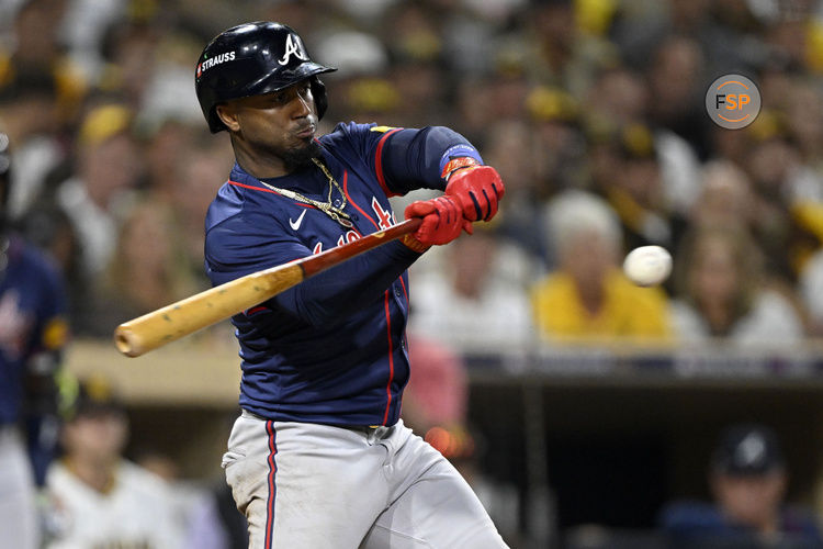 Oct 1, 2024; San Diego, California, USA; Atlanta Braves second base Ozzie Albies (1) hits a single during the eighth inning against the San Diego Padres in game one of the Wildcard round for the 2024 MLB Playoffs at Petco Park. Credit: Denis Poroy-Imagn Images