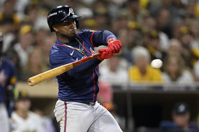 Oct 1, 2024; San Diego, California, USA; Atlanta Braves second base Ozzie Albies (1) hits a single during the eighth inning against the San Diego Padres in game one of the Wildcard round for the 2024 MLB Playoffs at Petco Park. Mandatory Credit: Denis Poroy-Imagn Images