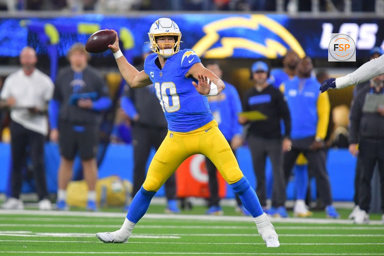 Dec 19, 2024; Inglewood, California, USA; Los Angeles Chargers quarterback Justin Herbert (10) throws against the Denver Broncos during the second half at SoFi Stadium. Credit: Gary A. Vasquez-Imagn Images