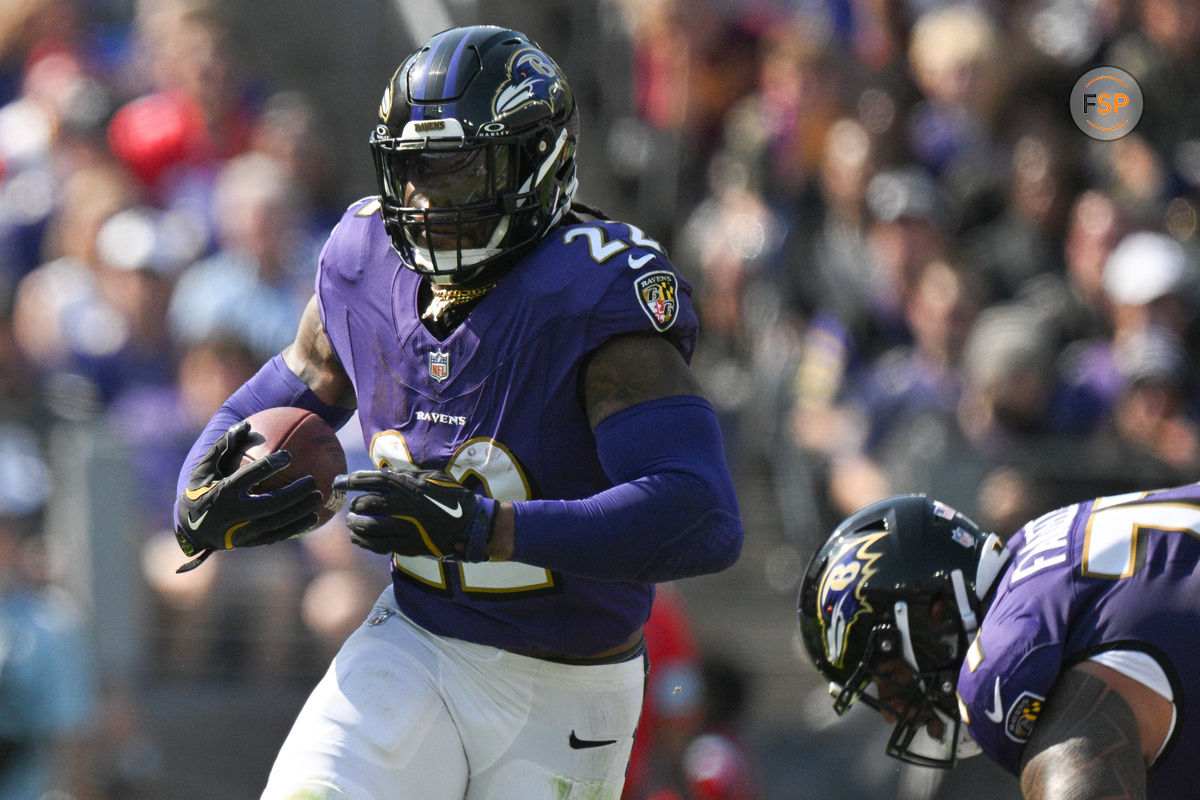 Oct 13, 2024; Baltimore, Maryland, USA;  Baltimore Ravens running back Derrick Henry (22) rushes during the first half against the Washington Commanders at M&T Bank Stadium. Credit: Tommy Gilligan-Imagn Images