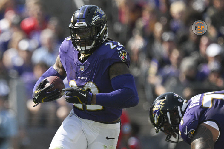 Oct 13, 2024; Baltimore, Maryland, USA;  Baltimore Ravens running back Derrick Henry (22) rushes during the first half against the Washington Commanders at M&T Bank Stadium. Credit: Tommy Gilligan-Imagn Images