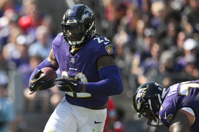 Oct 13, 2024; Baltimore, Maryland, USA;  Baltimore Ravens running back Derrick Henry (22) rushes during the first half against the Washington Commanders at M&T Bank Stadium. Mandatory Credit: Tommy Gilligan-Imagn Images