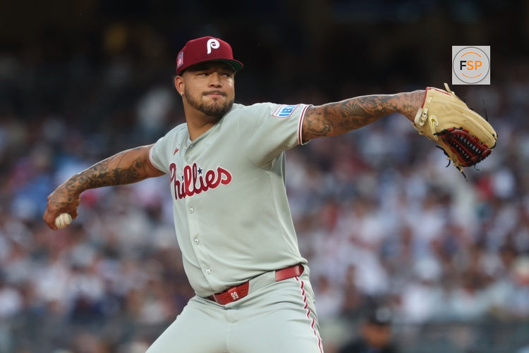 Jul 25, 2025; Bronx, New York, USA; Philadelphia Phillies relief pitcher Taijuan Walker (99) delivers a pitch during the second inning against the New York Yankees at Yankee Stadium. Credit: Vincent Carchietta-Imagn Images