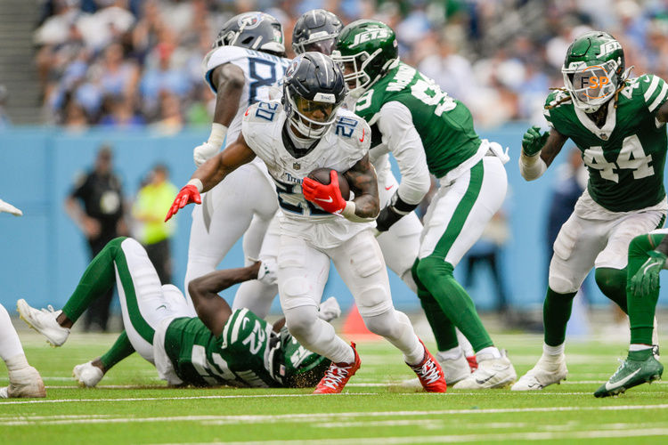 Sep 15, 2024; Nashville, Tennessee, USA;  Tennessee Titans running back Tony Pollard (20) runs the ball against the New York Jets during the second half at Nissan Stadium. Credit: Steve Roberts-Imagn Images