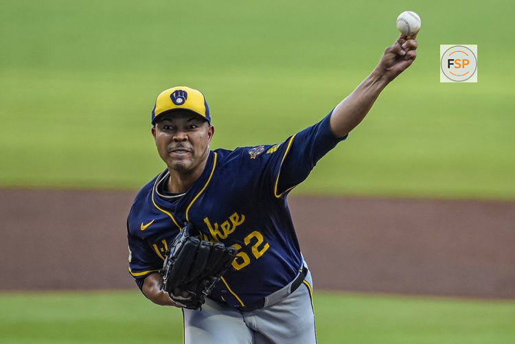 Aug 6, 2025; Cumberland, Georgia, USA; Milwaukee Brewers pitcher Jose Quintana (62) pitches against the Atlanta Braves during the first inning at Truist Park. Credit: Dale Zanine-Imagn Images