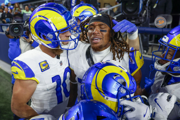 Nov 3, 2024; Seattle, Washington, USA; Los Angeles Rams wide receiver Demarcus Robinson (15, middle) celebrates with teammates, including wide receiver Cooper Kupp (10, left), after catching a game-wining touchdown pass against the Seattle Seahawks during overtime at Lumen Field. Credit: Joe Nicholson-Imagn Images