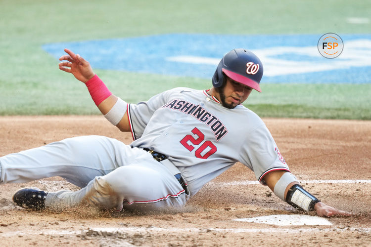 Apr 12, 2025; Miami, Florida, USA;  Washington Nationals catcher Keibert Ruiz (20) scores a run in the third inning against the Miami Marlins at loanDepot Park. Credit: Jim Rassol-Imagn Images