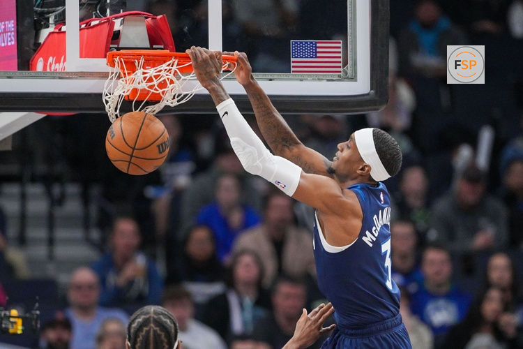 Mar 4, 2025; Minneapolis, Minnesota, USA; Minnesota Timberwolves forward Jaden McDaniels (3) dunks against the Philadelphia 76ers in the third quarter at Target Center. Credit: Brad Rempel-Imagn Images