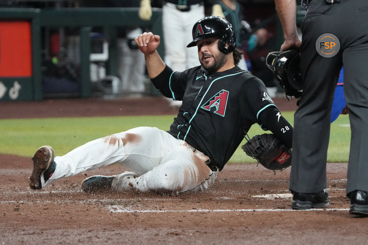 May 7, 2025; Phoenix, Arizona, USA; Arizona Diamondbacks third base Eugenio Suarez (28) gets tagged out trying to score against the New York Mets in the second inning at Chase Field. Credit: Rick Scuteri-Imagn Images