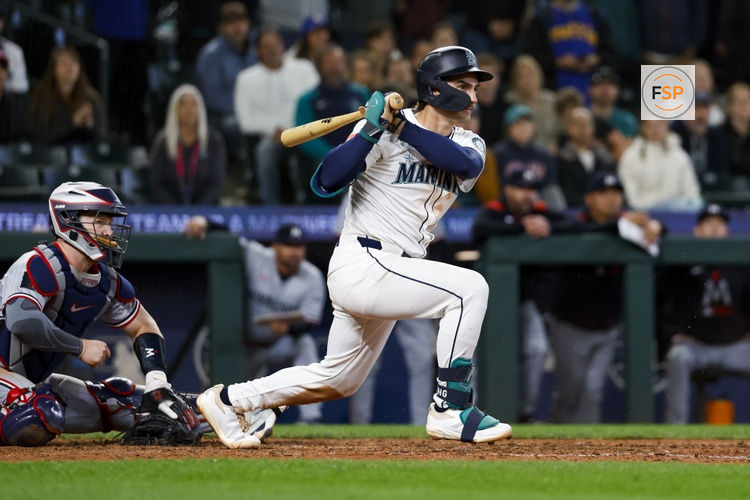 May 31, 2025; Seattle, Washington, USA; Seattle Mariners second baseman Cole Young (2) hits a walk-off RBI-fielders choice against the Minnesota Twins during the eleventh inning at T-Mobile Park. Credit: Joe Nicholson-Imagn Images