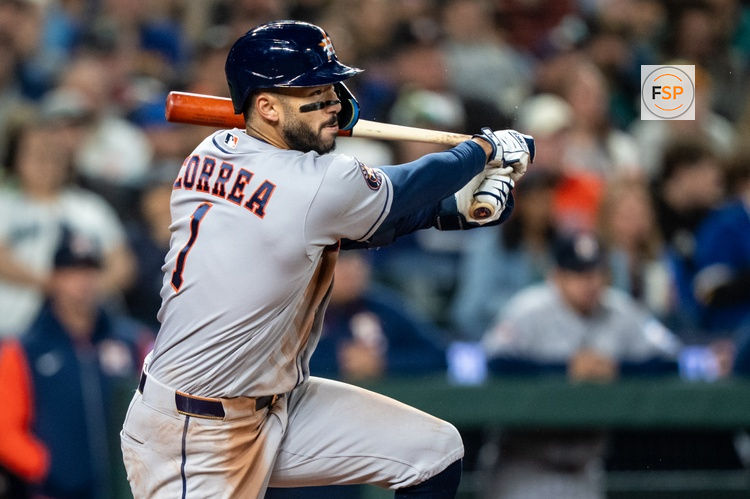 Apr 11, 2026; Seattle, Washington, USA; Houston Astros third baseman Carlos Correa (1) breaks his bat a hits single during the third inning against the Seattle Mariners at T-Mobile Park. Credit: Stephen Brashear-Imagn Images