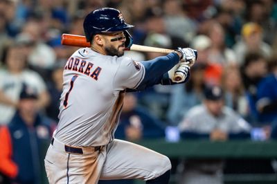 Apr 11, 2026; Seattle, Washington, USA; Houston Astros third baseman Carlos Correa (1) breaks his bat a hits single during the third inning against the Seattle Mariners at T-Mobile Park. Mandatory Credit: Stephen Brashear-Imagn Images