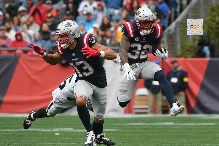 Sep 7, 2025; Foxborough, Massachusetts, USA; New England Patriots running back TreVeyon Henderson (32) rushes the ball against the Las Vegas Raiders during the first half at Gillette Stadium. Credit: Bob DeChiara-Imagn Images