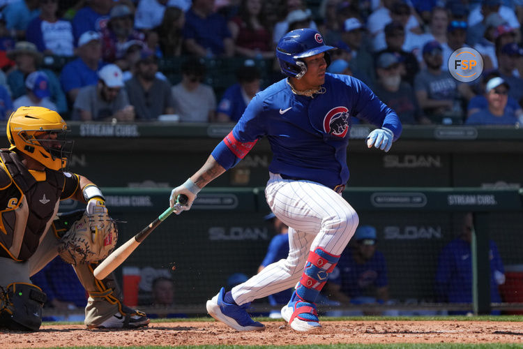 Mar 21, 2025; Mesa, Arizona, USA; Chicago Cubs catcher Moises Ballesteros hits against the San Diego Padres in the first inning at Sloan Park. Credit: Rick Scuteri-Imagn Images