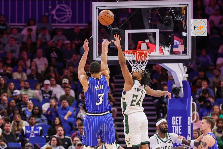 Feb 9, 2026; Orlando, Florida, USA; Orlando Magic guard Desmond Bane (3) shoots against Milwaukee Bucks guard Cam Thomas (24) during the second quarter at Kia Center. Credit: Mike Watters-Imagn Images