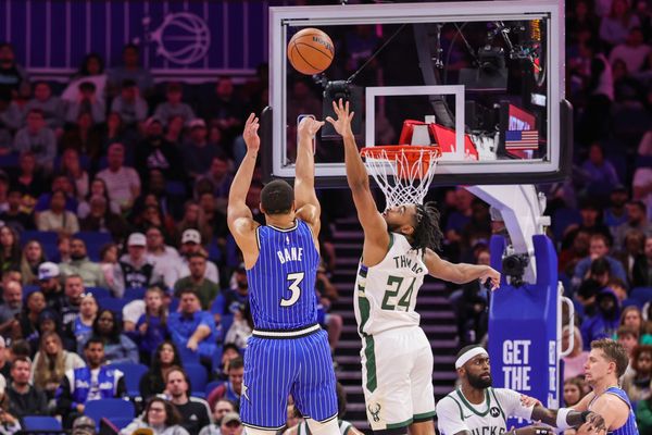 Feb 9, 2026; Orlando, Florida, USA; Orlando Magic guard Desmond Bane (3) shoots against Milwaukee Bucks guard Cam Thomas (24) during the second quarter at Kia Center. Mandatory Credit: Mike Watters-Imagn Images