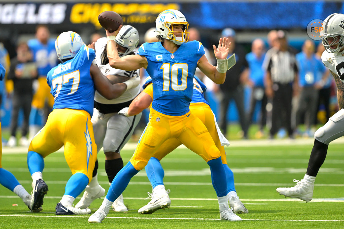 Sep 8, 2024; Inglewood, California, USA; Los Angeles Chargers quarterback Justin Herbert (10) looks to pass in the first half against the Las Vegas Raiders at SoFi Stadium. Credit: Jayne Kamin-Oncea-Imagn Images