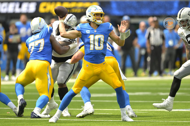 Sep 8, 2024; Inglewood, California, USA; Los Angeles Chargers quarterback Justin Herbert (10) looks to pass in the first half against the Las Vegas Raiders at SoFi Stadium. Credit: Jayne Kamin-Oncea-Imagn Images