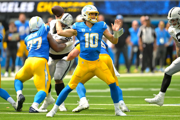 Sep 8, 2024; Inglewood, California, USA; Los Angeles Chargers quarterback Justin Herbert (10) looks to pass in the first half against the Las Vegas Raiders at SoFi Stadium. Mandatory Credit: Jayne Kamin-Oncea-Imagn Images