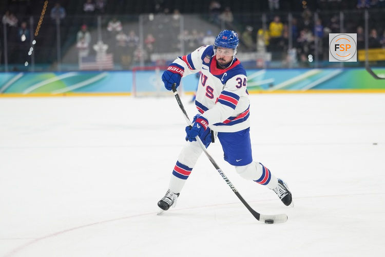 Feb 20, 2026; Milan, Italy; Auston Matthews (34) of the United States warms up before the game against Slovakia in a men's ice hockey semifinal during the Milano Cortina 2026 Olympic Winter Games at Milano Santagiulia Ice Hockey Arena. Credit: James Lang-Imagn Images