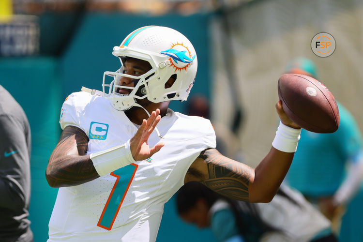 Sep 8, 2024; Miami Gardens, Florida, USA; Miami Dolphins quarterback Tua Tagovailoa (1) throws the football before the game against the Jacksonville Jaguars at Hard Rock Stadium. Credit: Sam Navarro-Imagn Images