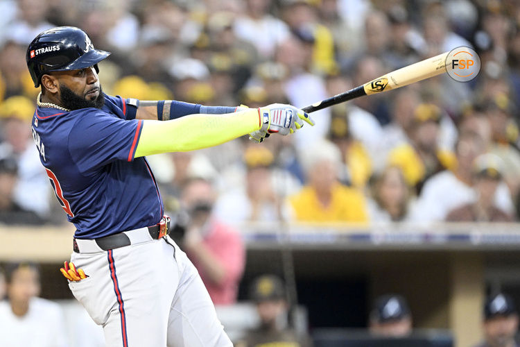 Oct 1, 2024; San Diego, California, USA; Atlanta Braves designated hitter Marcell Ozuna (20) hits a single during the third inning in game one of the Wildcard round for the 2024 MLB Playoffs at Petco Park. Credit: Denis Poroy-Imagn Images