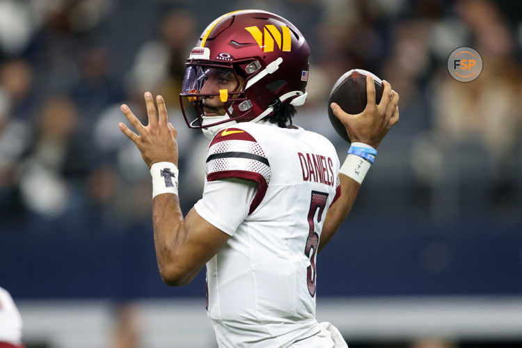 Jan 5, 2025; Arlington, Texas, USA; Washington Commanders quarterback Jayden Daniels (5) throws a pass against the Dallas Cowboys during the first quarter at AT&T Stadium. Credit: Tim Heitman-Imagn Images