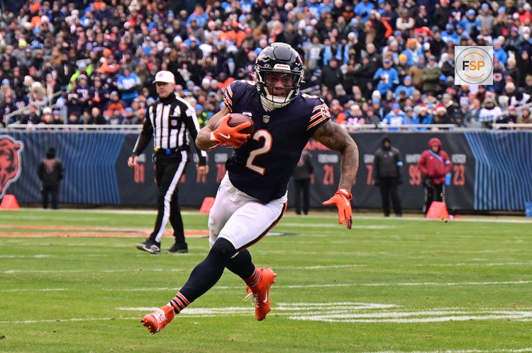 Dec 22, 2024; Chicago, Illinois, USA; Chicago Bears wide receiver DJ Moore (2) runs after a catch against the Detroit Lions during the second quarter at Soldier Field. Credit: Daniel Bartel-Imagn Images