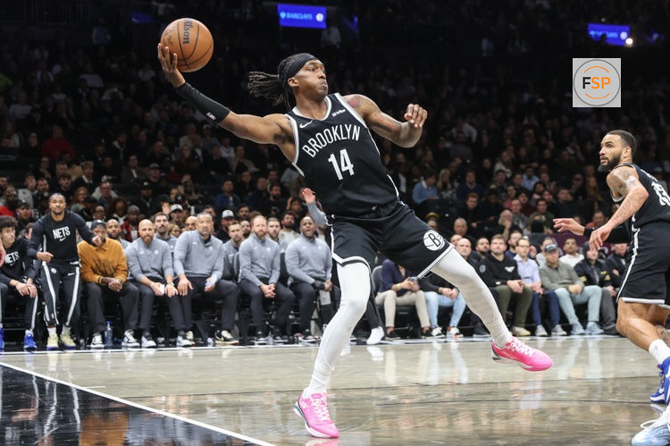Oct 29, 2025; Brooklyn, New York, USA; Brooklyn Nets guard Terance Mann (14) saves the ball from going out of bounds in the fourth quarter against the Atlanta Hawks at Barclays Center. Credit: Wendell Cruz-Imagn Images