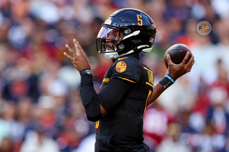 Oct 27, 2024; Landover, Maryland, USA; Washington Commanders quarterback Jayden Daniels (5) throws a pass during the first quarter against the Chicago Bears at Commanders Field. Credit: Peter Casey-Imagn Images