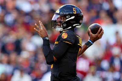 Oct 27, 2024; Landover, Maryland, USA; Washington Commanders quarterback Jayden Daniels (5) throws a pass during the first quarter against the Chicago Bears at Commanders Field. Mandatory Credit: Peter Casey-Imagn Images