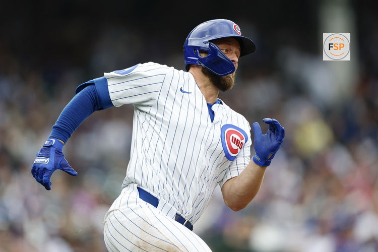 Apr 18, 2025; Chicago, Illinois, USA; Chicago Cubs first baseman Michael Busch (29) runs after hitting a double against the Arizona Diamondbacks during the fourth inning at Wrigley Field. Credit: Kamil Krzaczynski-Imagn Images