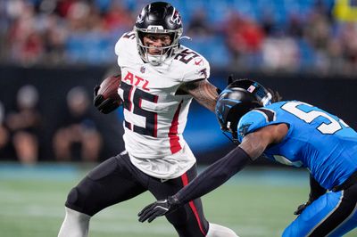 Oct 13, 2024; Charlotte, North Carolina, USA; Atlanta Falcons running back Tyler Allgeier (25) stiff arms Carolina Panthers linebacker Claudin Cherelus (53) during the second half at Bank of America Stadium. Mandatory Credit: Jim Dedmon-Imagn Images