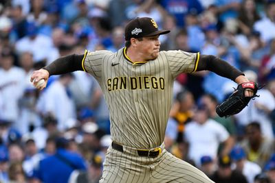 Oct 1, 2025; Chicago, Illinois, USA; San Diego Padres pitcher Mason Miller (22) delivers during the seventh inning against the Chicago Cubs during game two of the Wildcard round for the 2025 MLB playoffs at Wrigley Field. Mandatory Credit: Matt Marton-Imagn Images