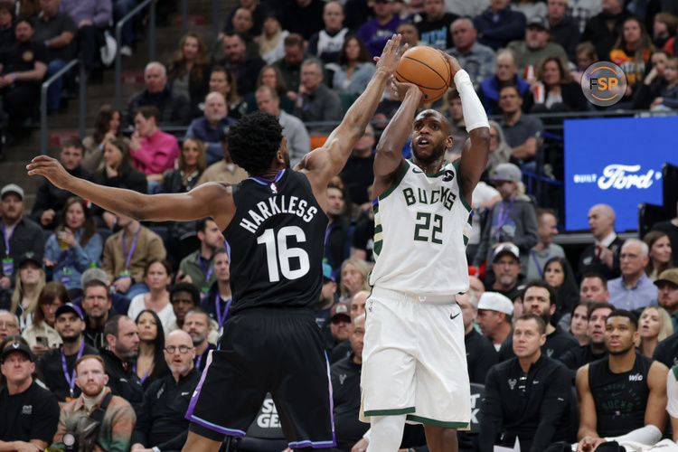 Jan 27, 2025; Salt Lake City, Utah, USA;  Milwaukee Bucks forward Khris Middleton (22) shoots the ball over Utah Jazz guard Elijah Harkless (16) during the second quarter at Delta Center. Credit: Chris Nicoll-Imagn Images