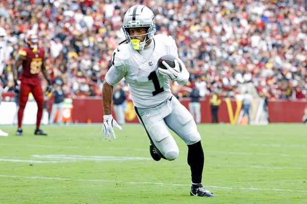 Sep 21, 2025; Landover, Maryland, USA; Las Vegas Raiders wide receiver Tre Tucker (1) runs a touchdown pass during the second half against the Washington Commanders at Northwest Stadium. Mandatory Credit: Amber Searls-Imagn Images