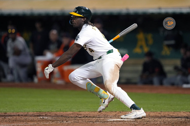 Sep 6, 2024; Oakland, California, USA; Oakland Athletics right fielder Lawrence Butler (4) hits a single against the Detroit Tigers during the seventh inning at Oakland-Alameda County Coliseum. Credit: Darren Yamashita-Imagn Images