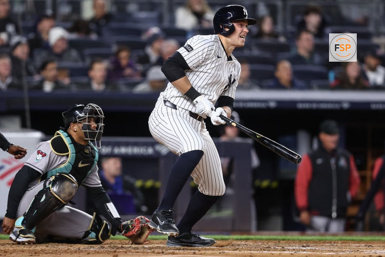Apr 1, 2025; Bronx, New York, USA;  New York Yankees designated hitter Ben Rice (22) hits a double in the third inning against the Arizona Diamondbacks at Yankee Stadium. Credit: Wendell Cruz-Imagn Images