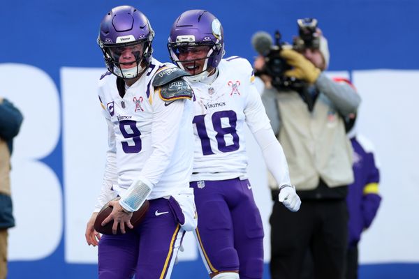 Dec 21, 2025; East Rutherford, New Jersey, USA; Minnesota Vikings quarterback J.J. McCarthy (9) reacts with wide receiver Justin Jefferson (18) after rushing for a touchdown against the New York Giants during the first half at MetLife Stadium. Mandatory Credit: Vincent Carchietta-Imagn Images