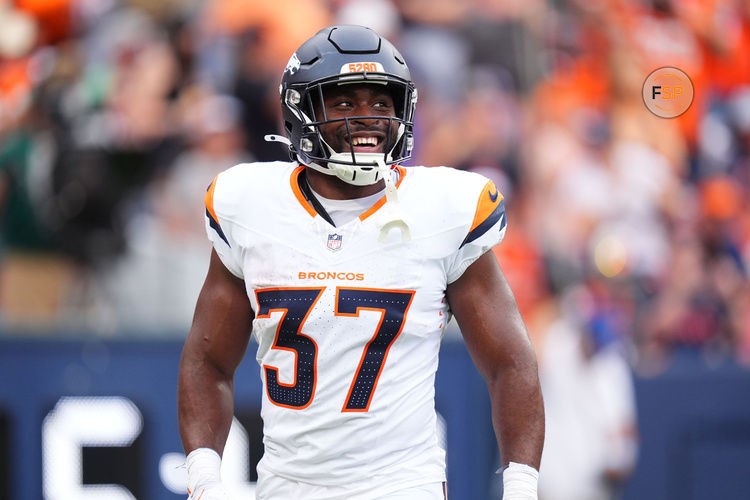 Aug 25, 2024; Denver, Colorado, USA; Denver Broncos running back Audric Estime (37) celebrates his touchdown in the first quarter against the Arizona Cardinals at Empower Field at Mile High. Credit: Ron Chenoy-USA TODAY Sports