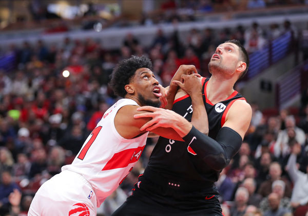 CHICAGO, IL - JANUARY 30: Thaddeus Young #21 of the Toronto Raptors box out Nikola Vucevic #9 of the Chicago Bulls during the first half against at the United Center on January 30, 2024 in Chicago, Illinois. (Photo by Melissa Tamez/Icon Sportswire)