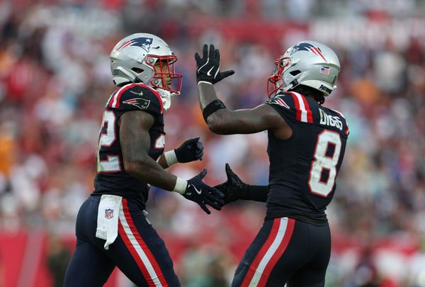 Nov 9, 2025; Tampa, Florida, USA; New England Patriots running back Treveyon Henderson (32) and wide receiver Stefon Diggs (8) celebrate a touchdown during the third quarter against the Tampa Bay Buccaneers at Raymond James Stadium. Mandatory Credit: Nathan Ray Seebeck-Imagn Images