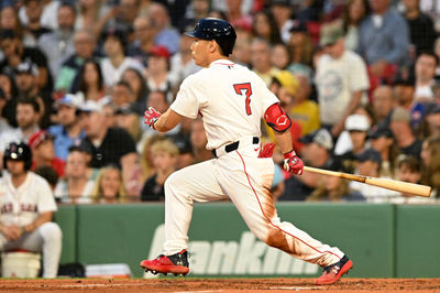 Jul 9, 2025; Boston, Massachusetts, USA;  Boston Red Sox designated hitter Masataka Yoshida (7) hits a RBI single against the Colorado Rockies during the fourth inning at Fenway Park. Mandatory Credit: Brian Fluharty-Imagn Images
