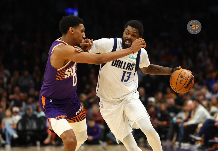 Dec 27, 2024; Phoenix, Arizona, USA; Dallas Mavericks forward Naji Marshall (13) against Phoenix Suns forward Ryan Dunn (0) at Footprint Center. Credit: Mark J. Rebilas-Imagn Images