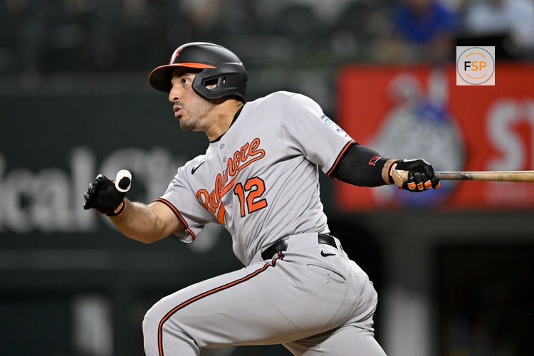 Jun 30, 2025; Arlington, Texas, USA; Baltimore Orioles right fielder Ramon Laureano (12) hits a double and drives in a run during the eleventh inning against the Texas Rangers at Globe Life Field. Credit: Jerome Miron-Imagn Images