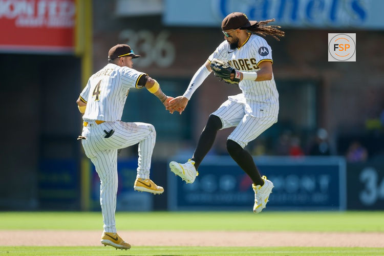 Jul 30, 2025; San Diego, California, USA; San Diego Padres first baseman Luis Arraez (4) celebrates with San Diego Padres right fielder Fernando Tatis Jr. (23) after defeating the New York Mets at Petco Park. Credit: David Frerker-Imagn Images