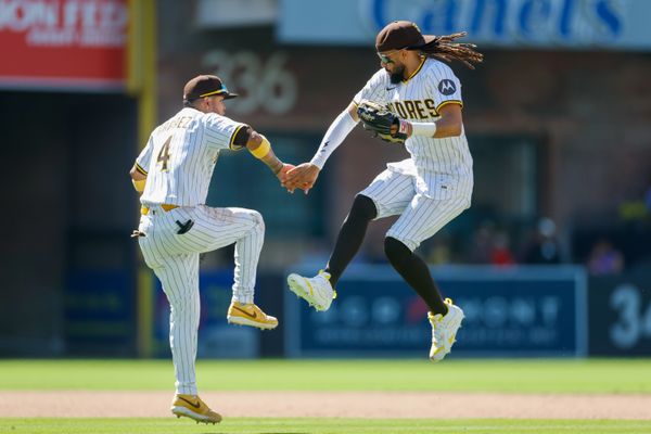Jul 30, 2025; San Diego, California, USA; San Diego Padres first baseman Luis Arraez (4) celebrates with San Diego Padres right fielder Fernando Tatis Jr. (23) after defeating the New York Mets at Petco Park. Mandatory Credit: David Frerker-Imagn Images