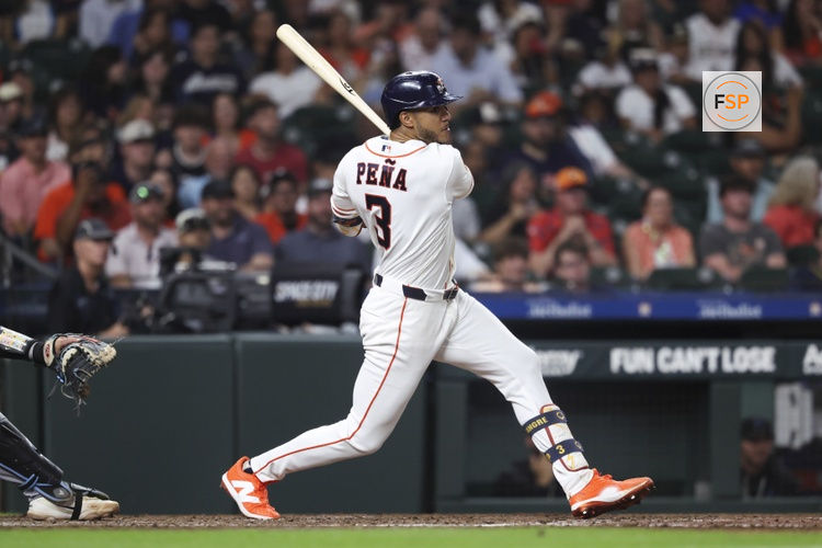 Jul 22, 2026; Houston, Texas, USA; Houston Astros shortstop Jeremy Pena (3) hits a single during the fifth inning against the Miami Marlins at Daikin Park. Credit: Troy Taormina-Imagn Images