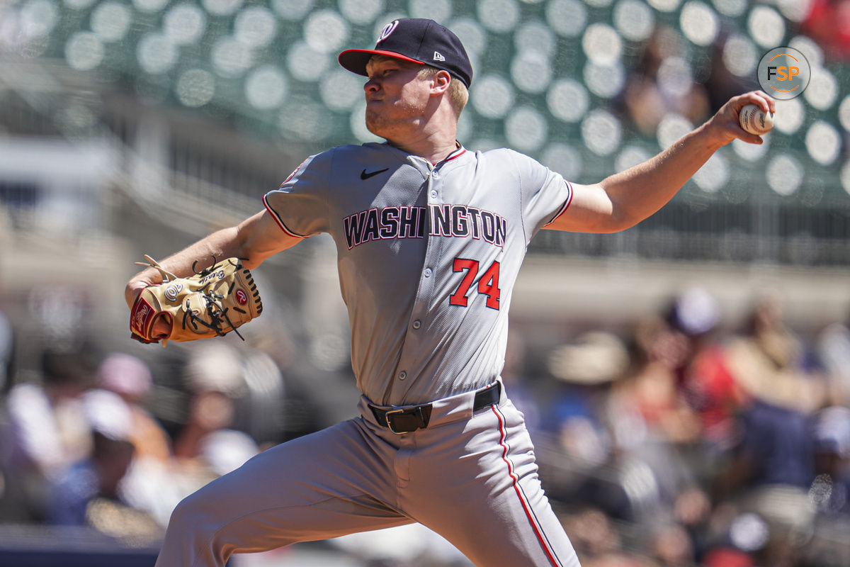 Aug 25, 2024; Cumberland, Georgia, USA; Washington Nationals starting pitcher DJ Herz (74) pitches against the Atlanta Braves during the third inning at Truist Park. Credit: Dale Zanine-USA TODAY Sports