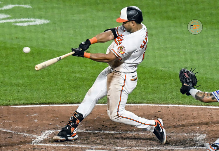 BALTIMORE, MD - August 5: Baltimore Orioles right fielder Anthony Santander (25) hits a home run during the New York Mets versus the Baltimore Orioles on August 5, 2023 at Oriole Park at Camden Yards in Baltimore, MD.  (Photo by Mark Goldman/Icon Sportswire)